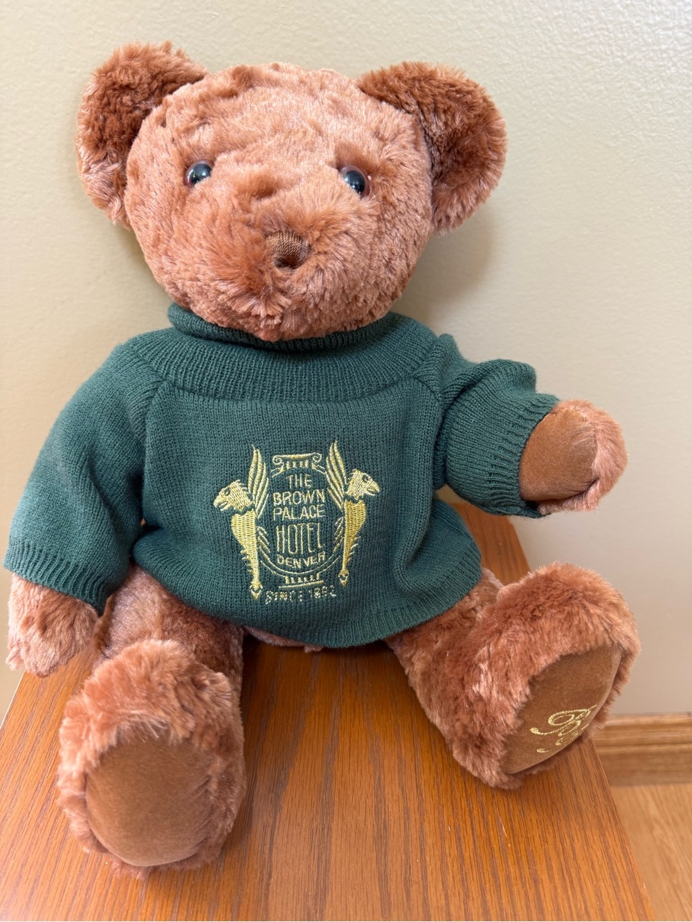 brown plush teddy bear wearing a dark green knit turtleneck sweater "The Brown P